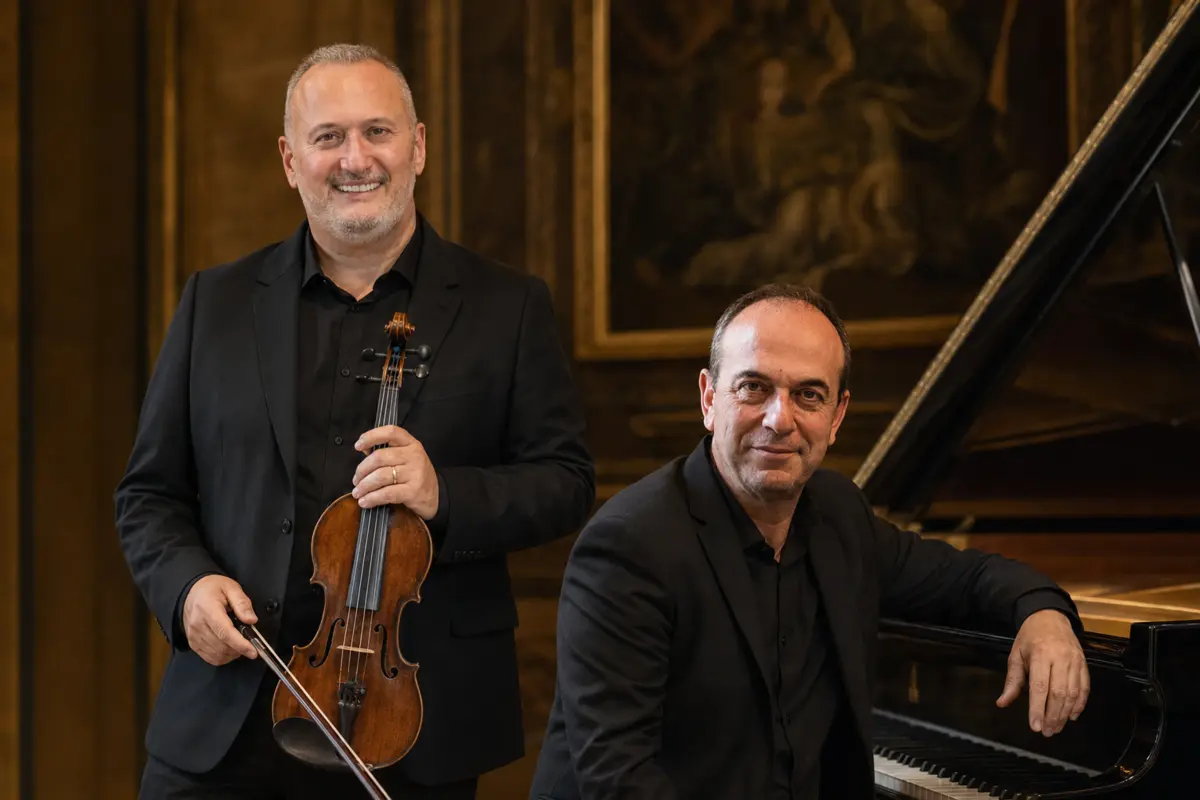 Paolo Castellani and Giuseppe Rossetti beside the piano